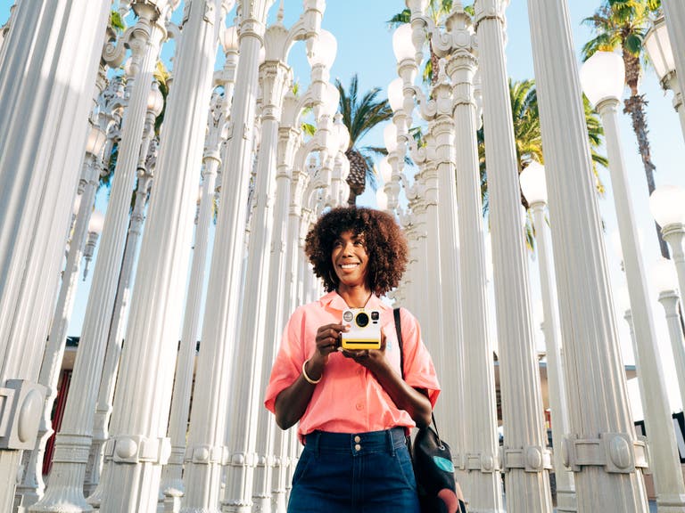 Actor from campaign photographed in street light installation outside LACMA